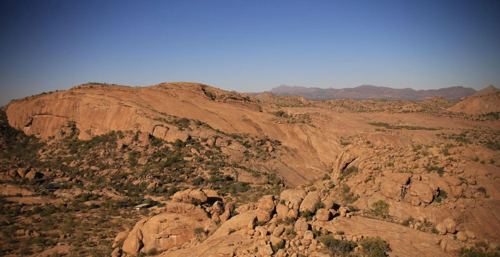 Weathered granite terrain and open plains in the Erongo region